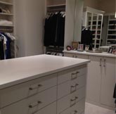 white custom closet with cabinet drawers
